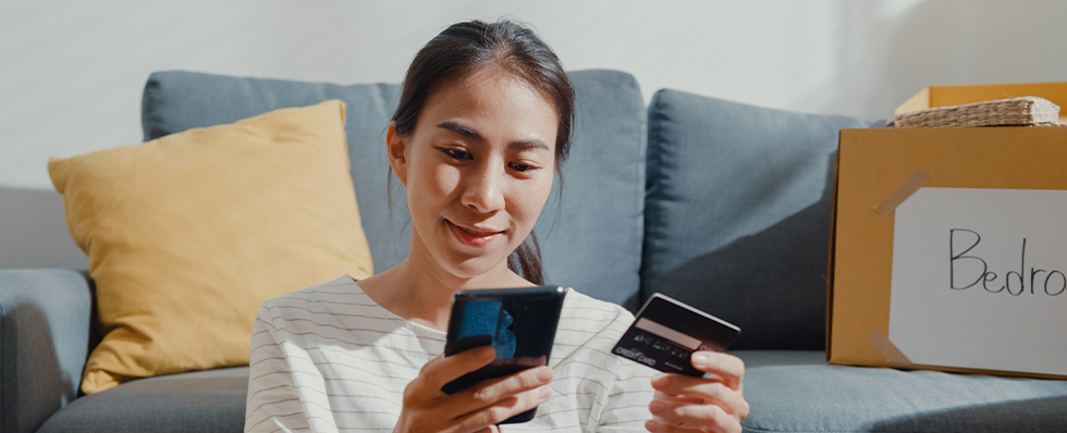 how to build credit with woman using mobile phone and credit card in hand