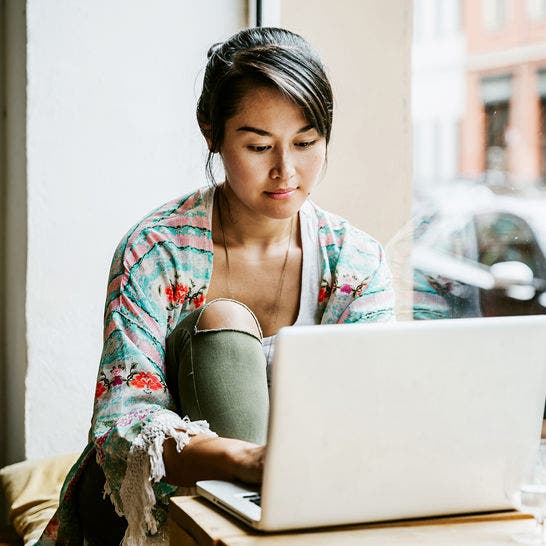 young woman working on laptop