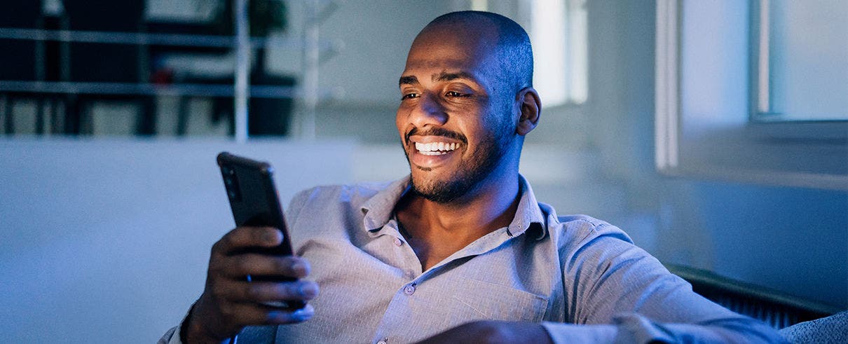 Man smiling on phone