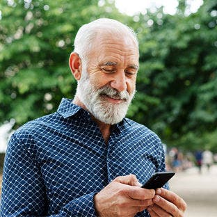 man using smartphone outside