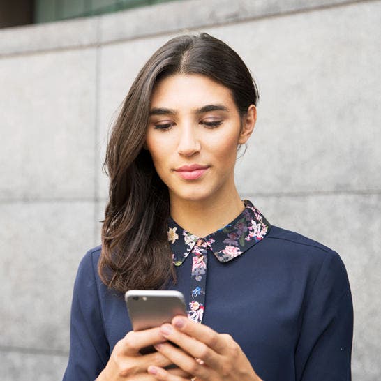 woman looking at smartphone