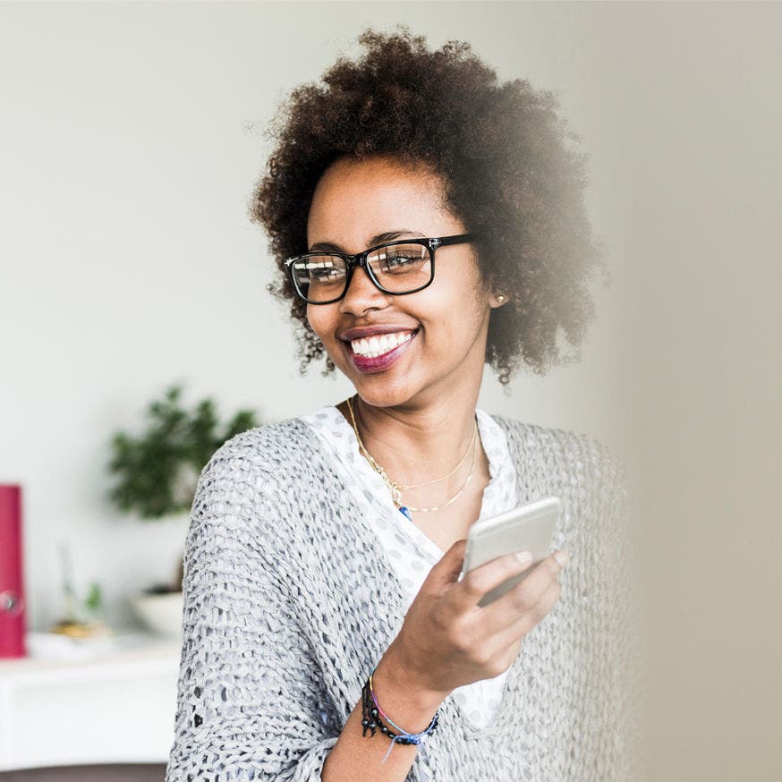 smiling woman using phone