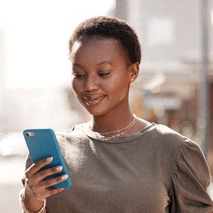 woman looking at smartphone