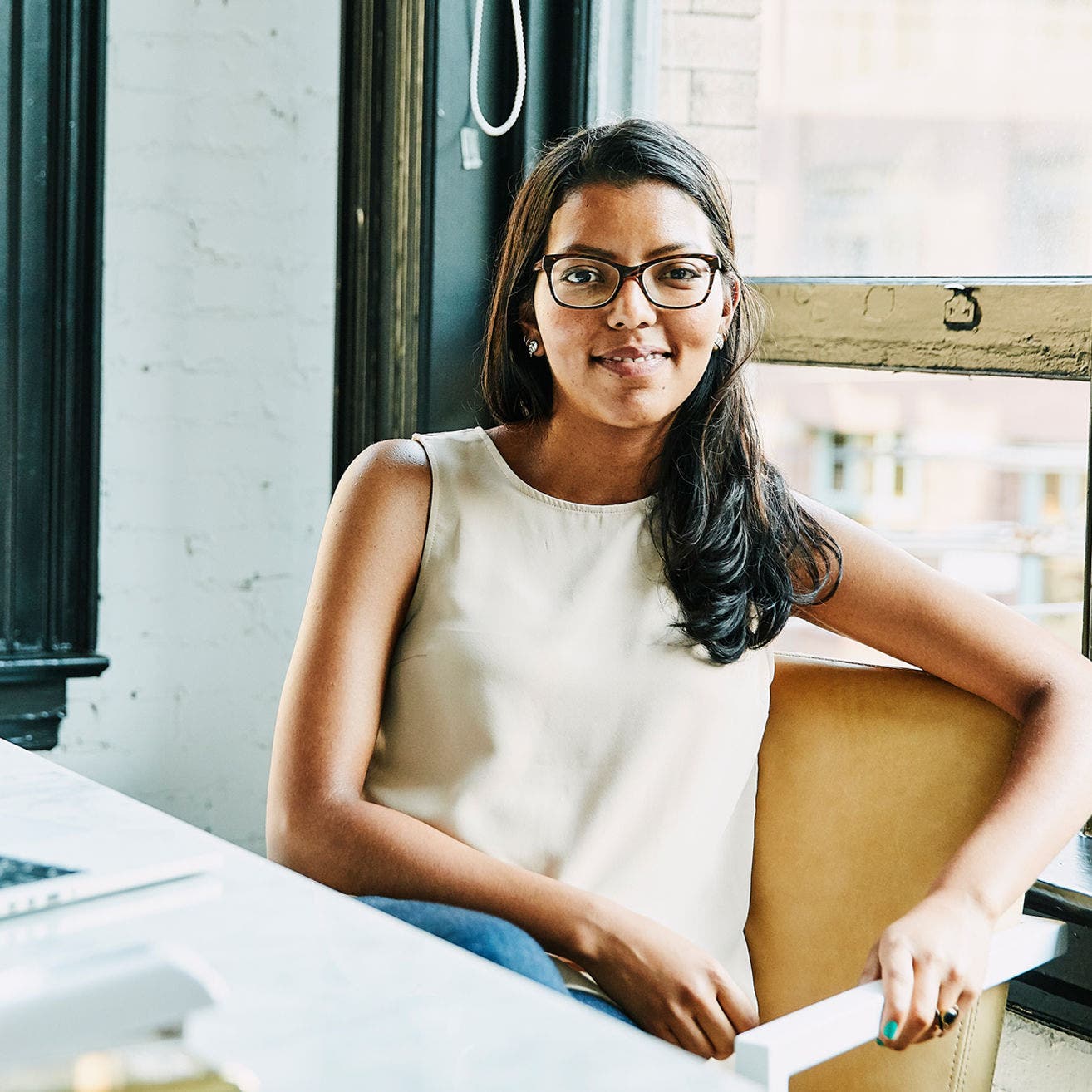 woman sitting at desk in apartment