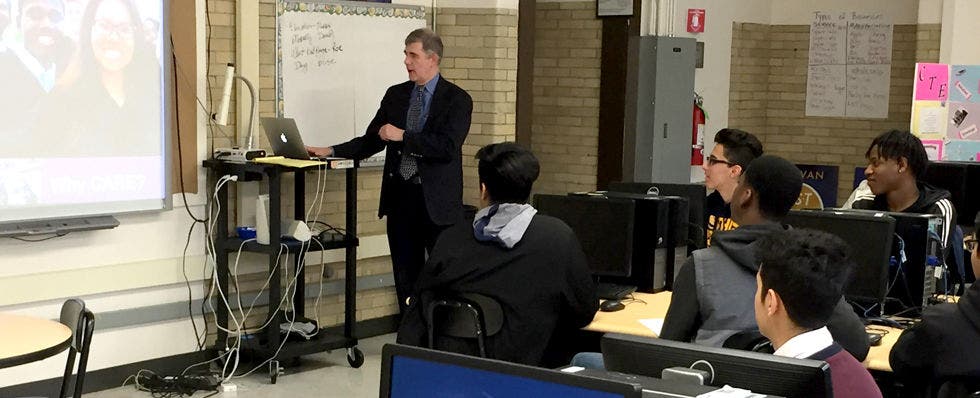 A classroom of students led by a CARE instructor