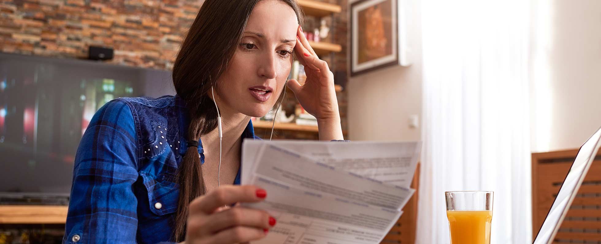 Woman looking at paperwork. 