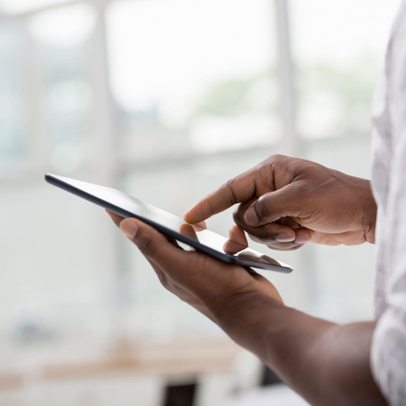 business person using tablet in office