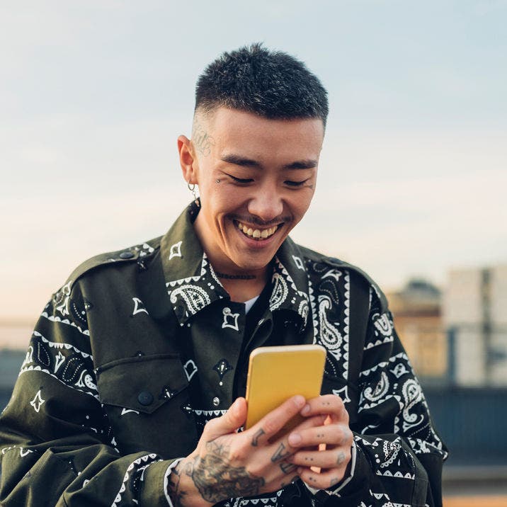 man using smartphone outside