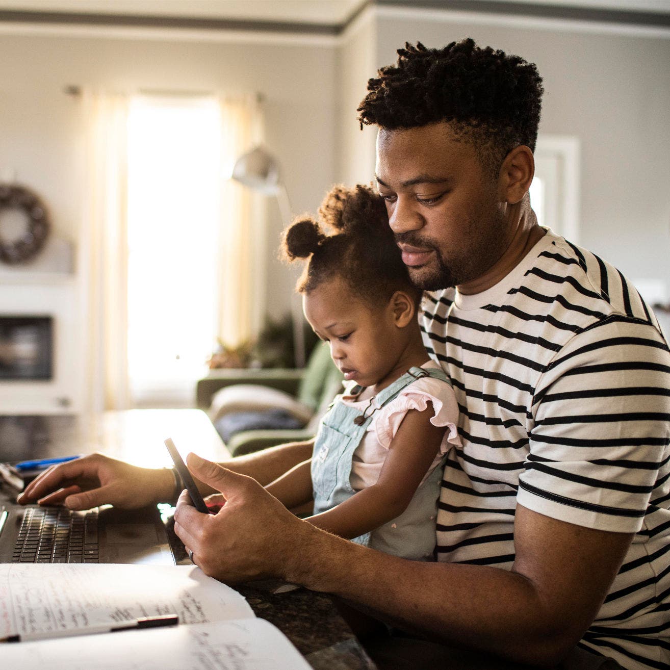 father and daughter in home office