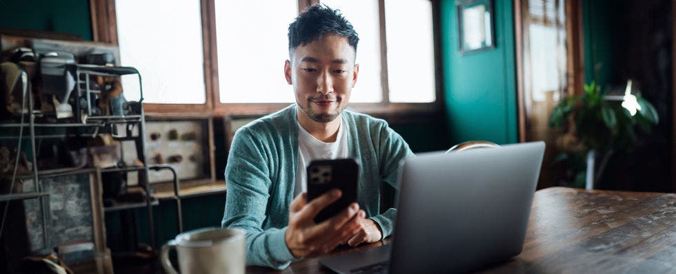 male using multi-factor authentication on cell phone 