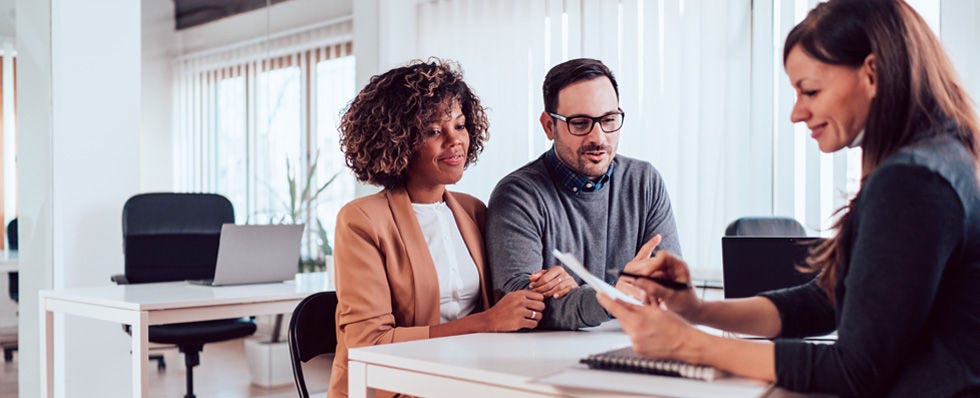 three people meeting modern office setting