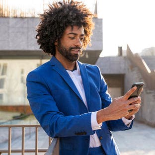 man using smartphone outside