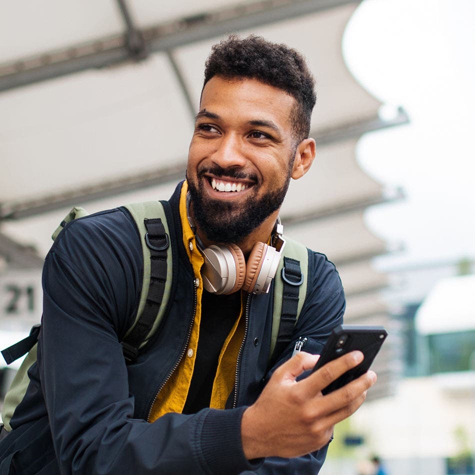 man using smartphone outside