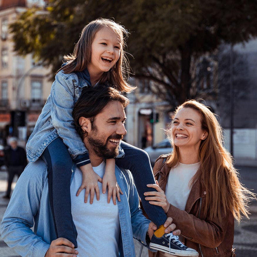 smiling family outside