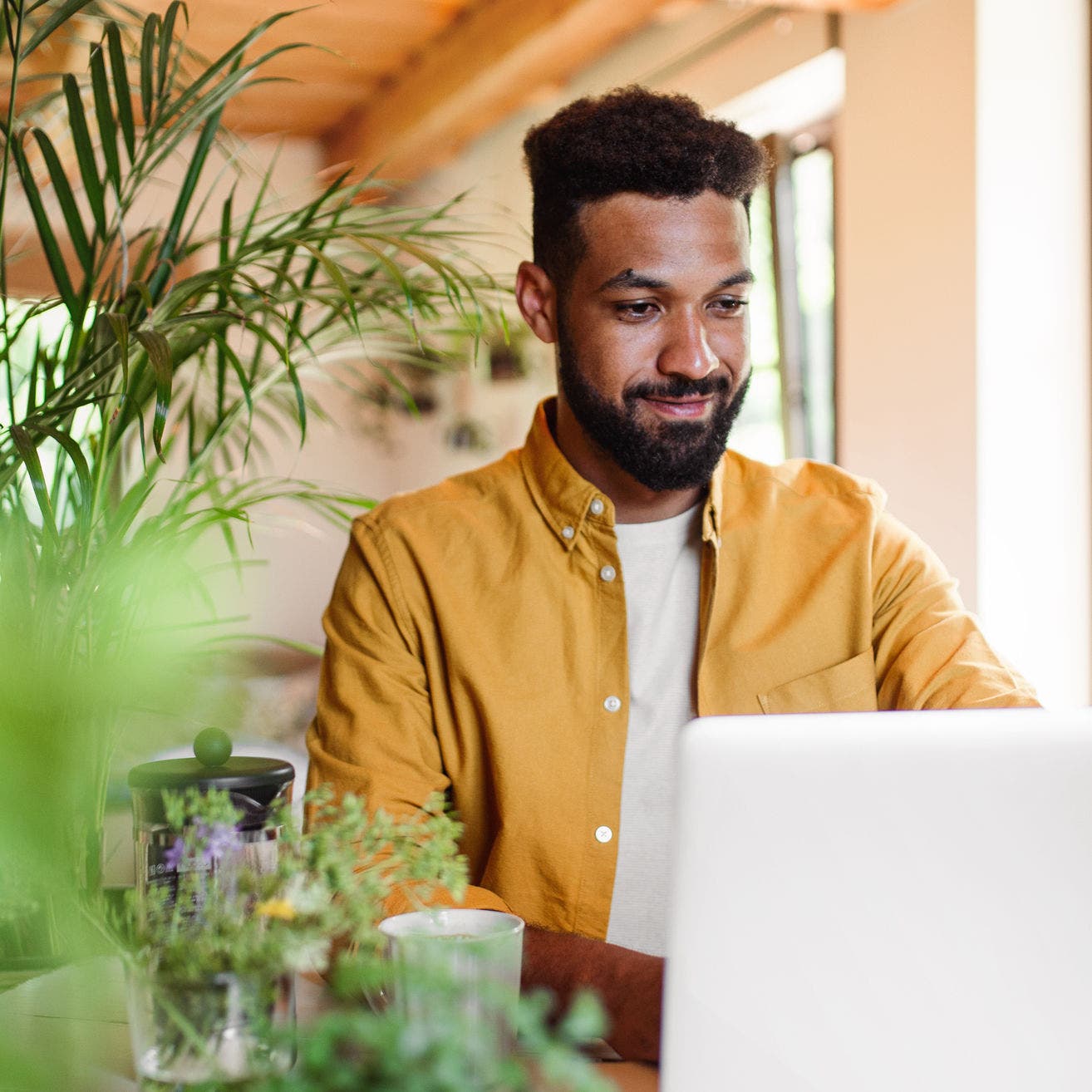 man using laptop at home