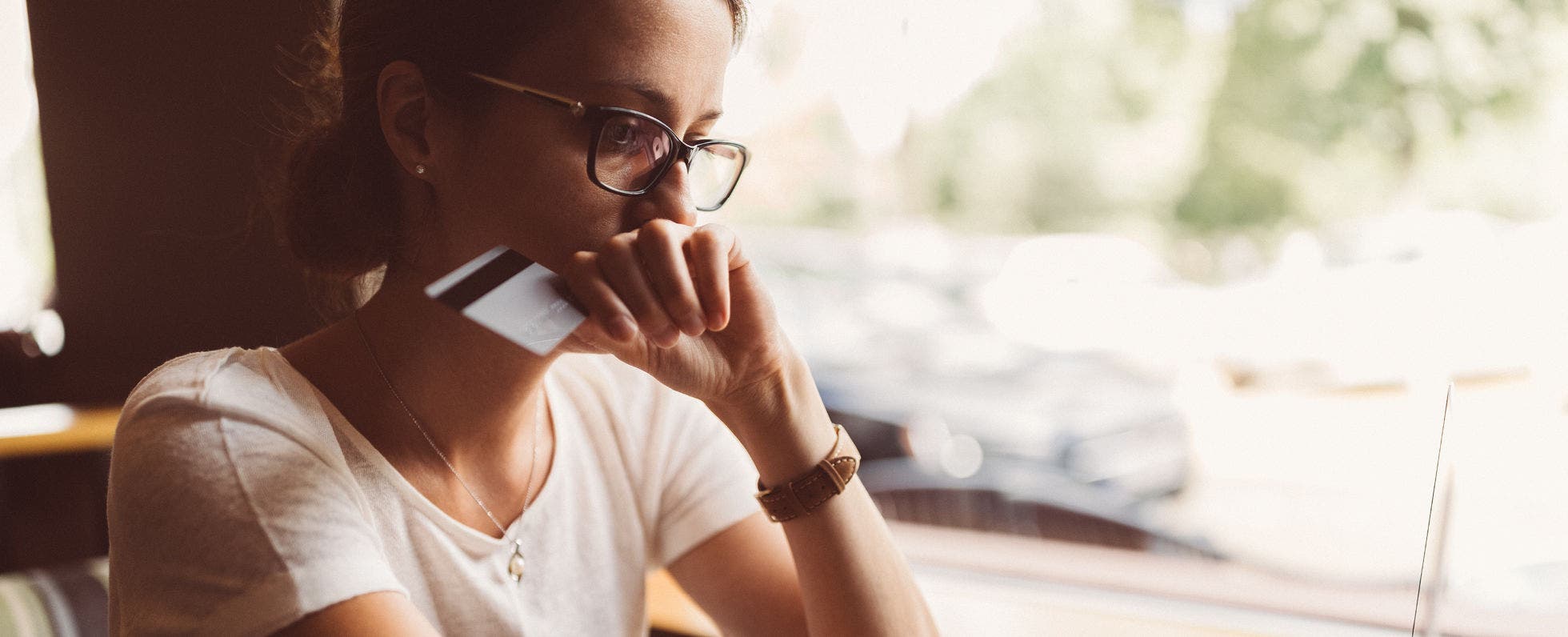 concerned woman with credit card