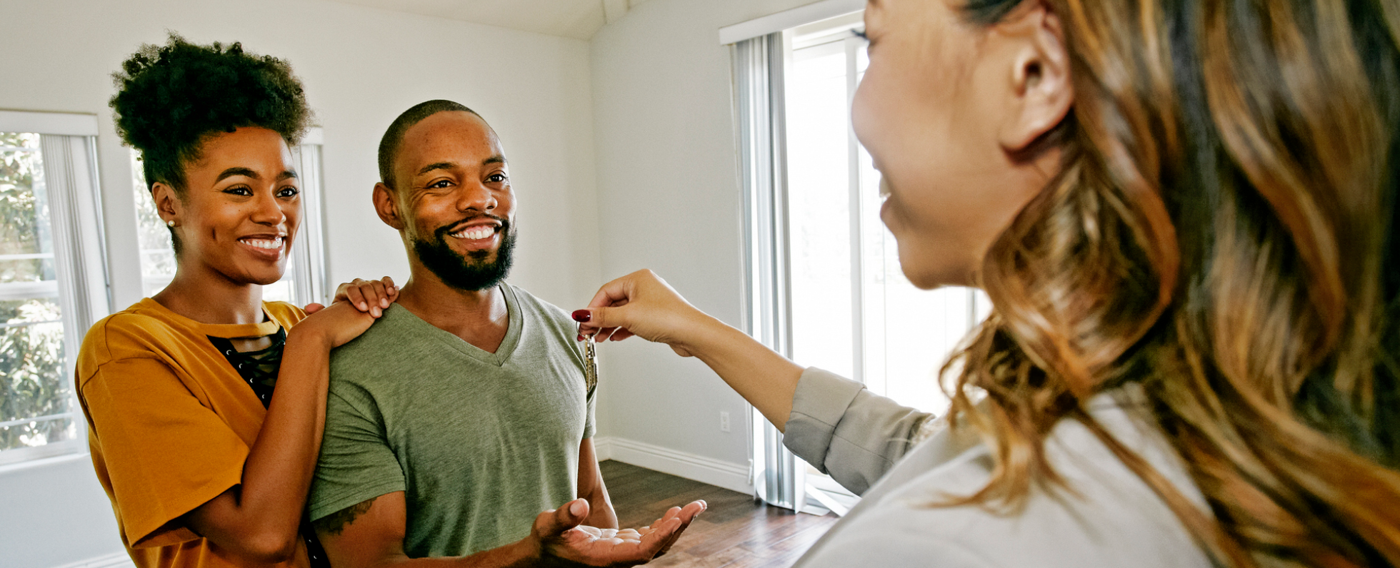couple getting keys to house