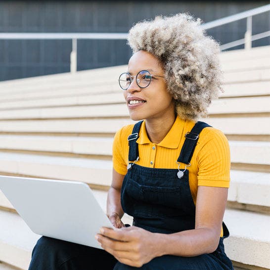 woman using laptop outside