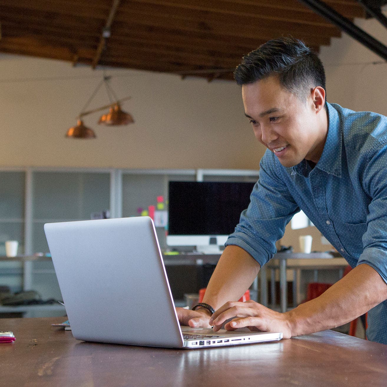 man working on laptop in office
