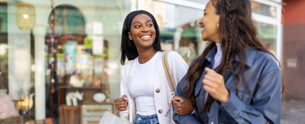 two ladies walking and having a conversation