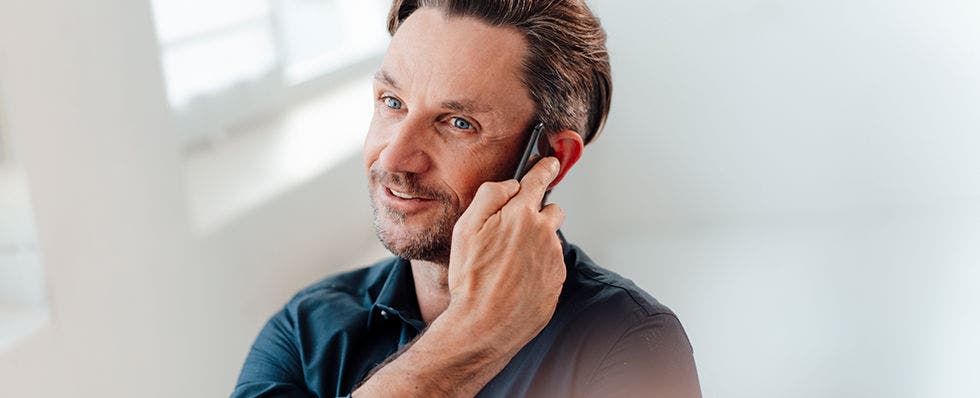NFL spam tagging blog header with man on phone
