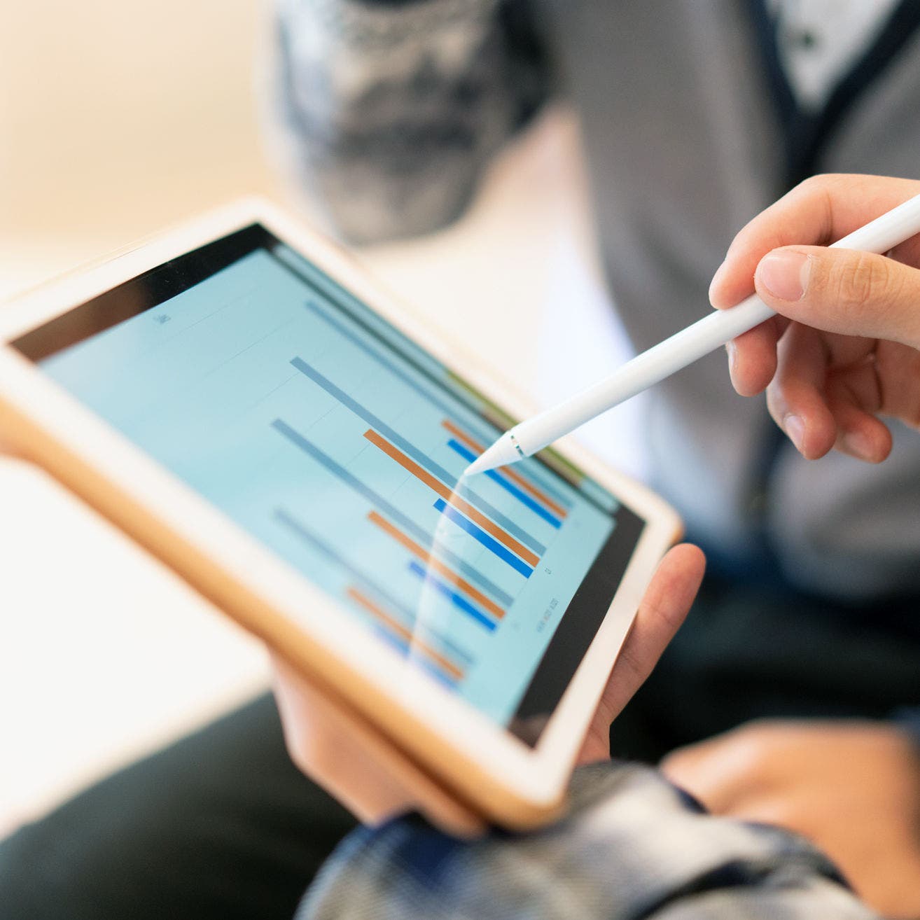 business person using tablet in office