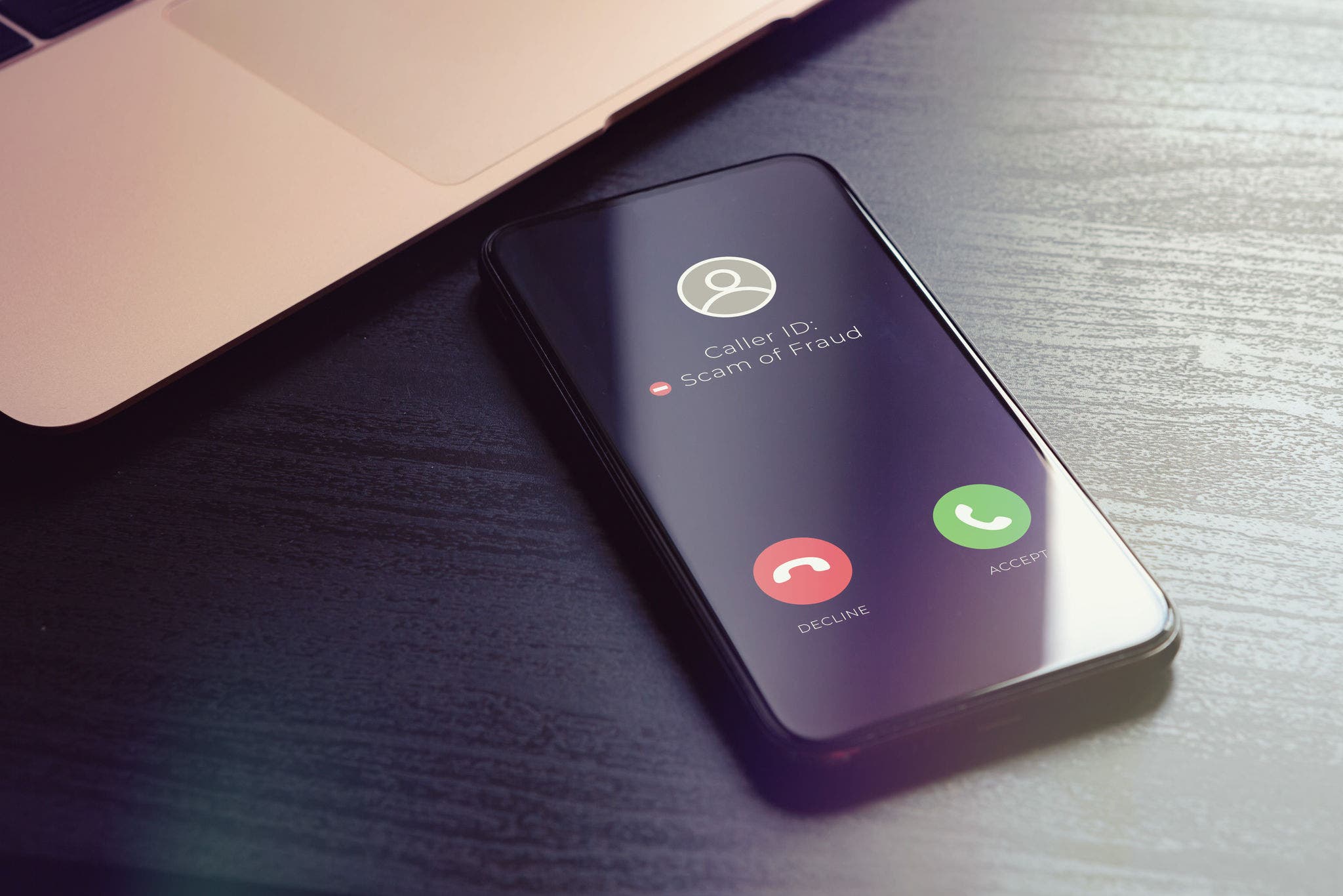 Scam fishing phone call from unknown number that was identified by a security anti-scam app as alert and fraudulent. Block Scam and Unwanted Calls concept. High quality photo