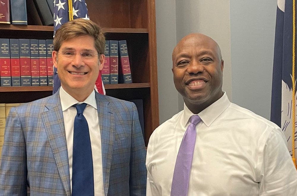 Trasunion CEO Chris Cartwright pictured with Senator Tim Scott