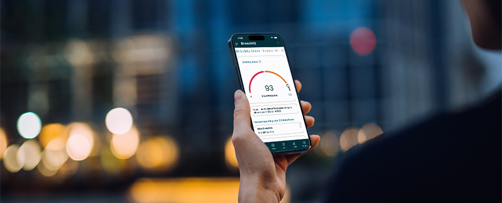 Image of man looking at credit score on smartphone.