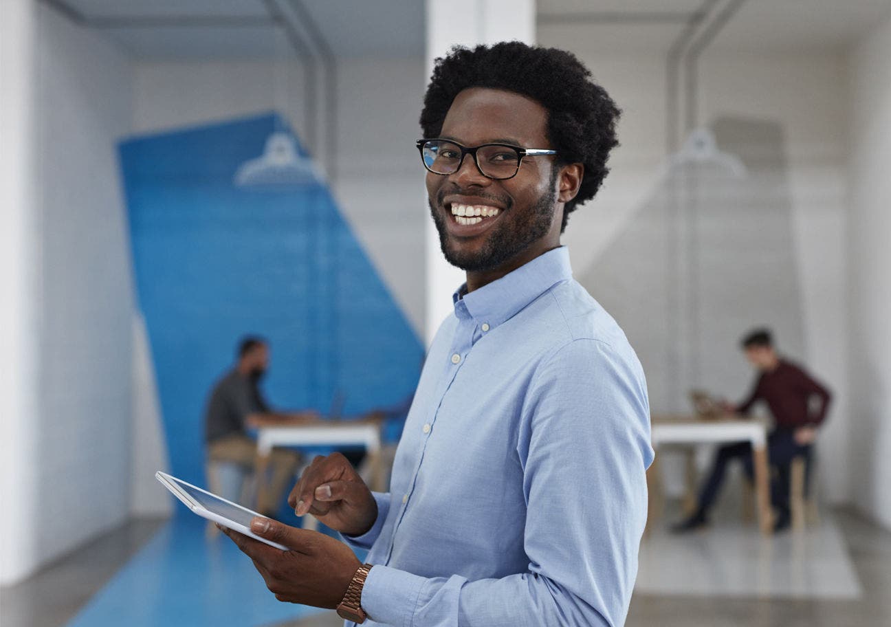 man using tablet in office