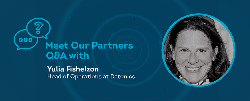A blue box with text "Meet Our Partners Q&A with Yulia Fishelzon" with black and white image of middle aged woman