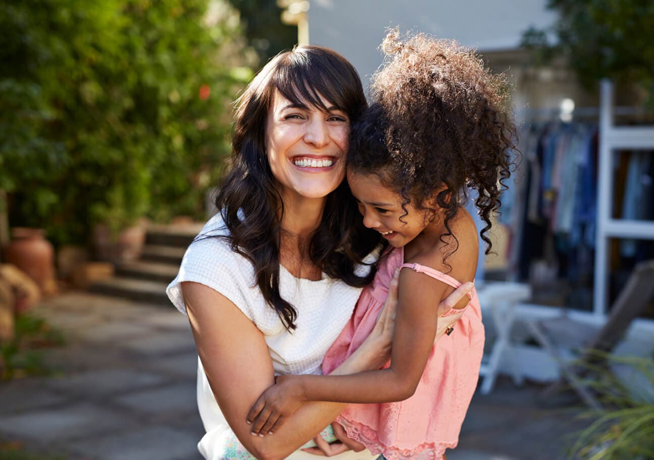 laughing mother and daughter