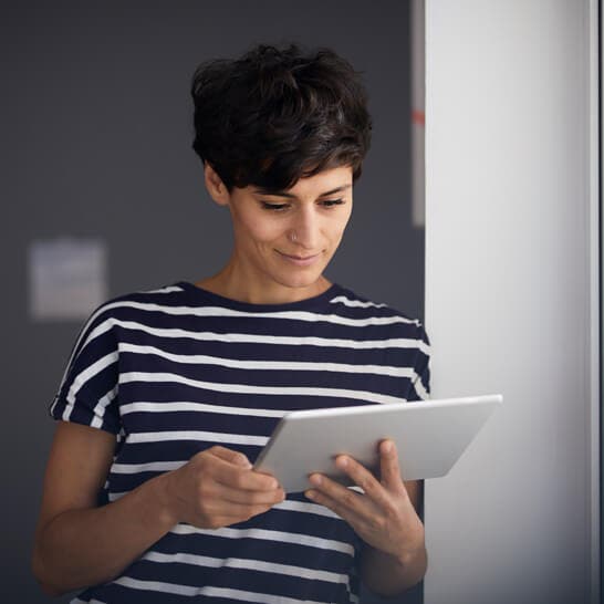 woman using tablet in office