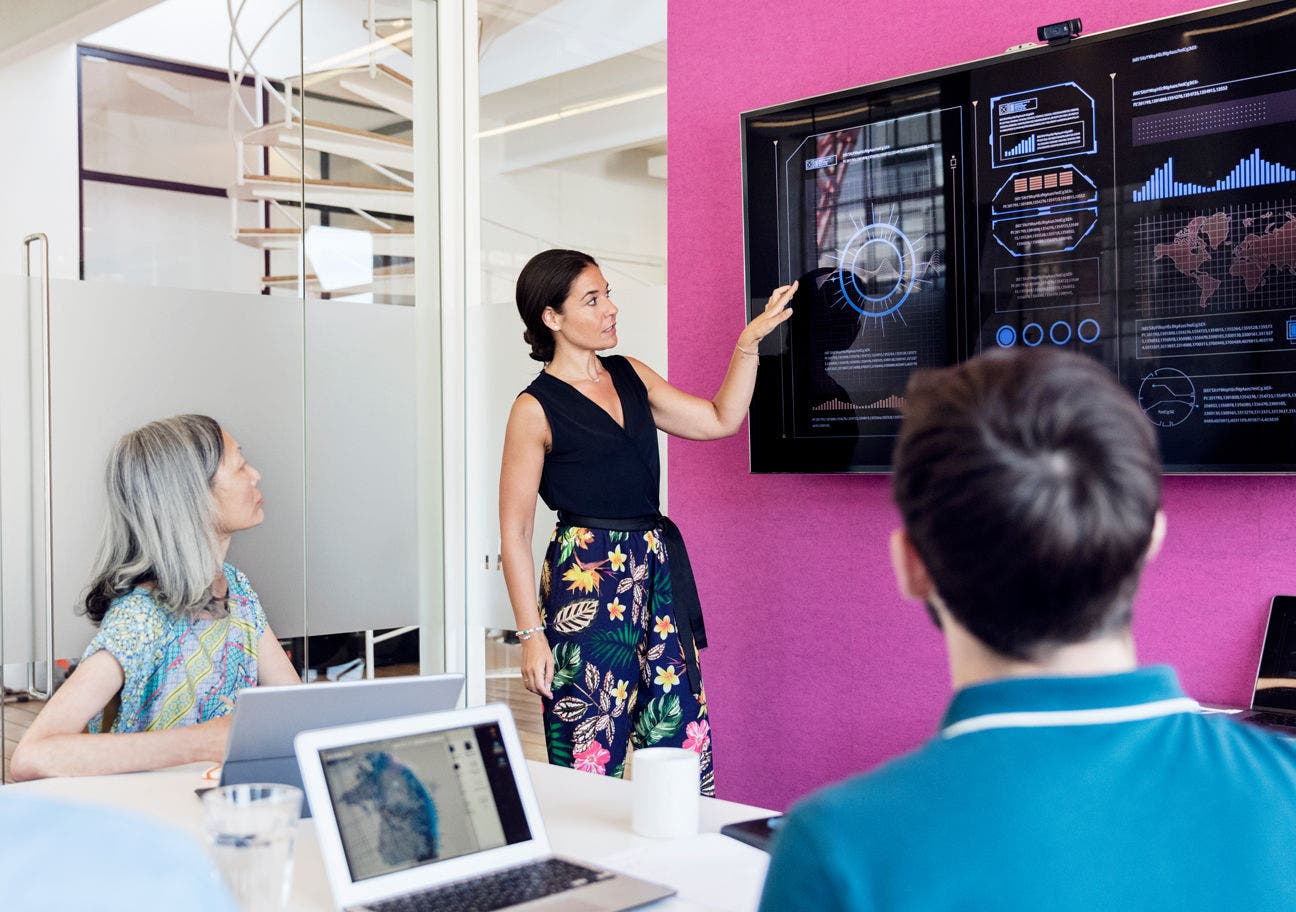 woman giving a presentation in a conference room