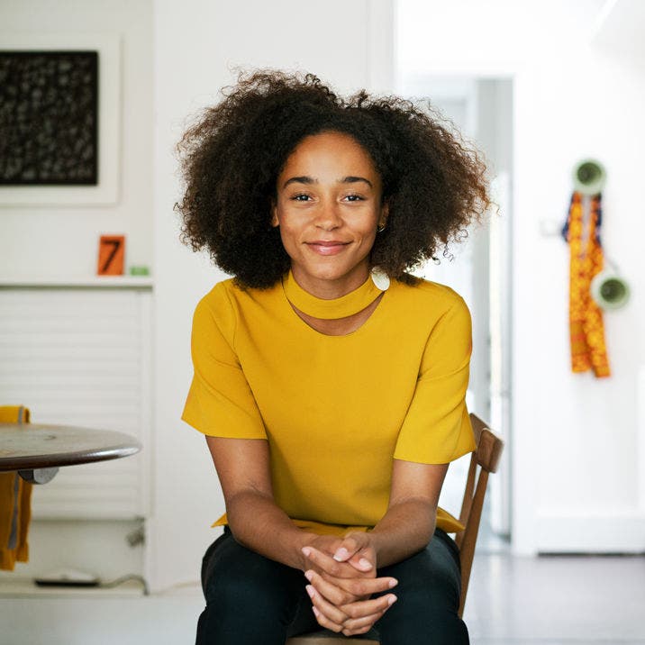 smiling young woman in kitchen
