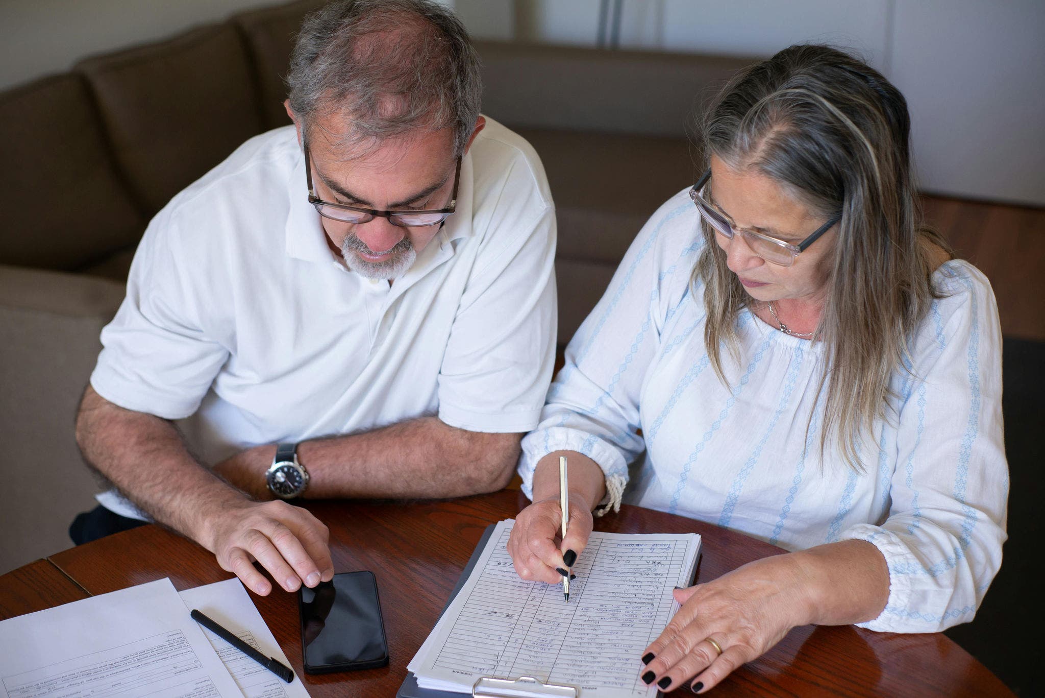 Couple sitting at the table going over finances