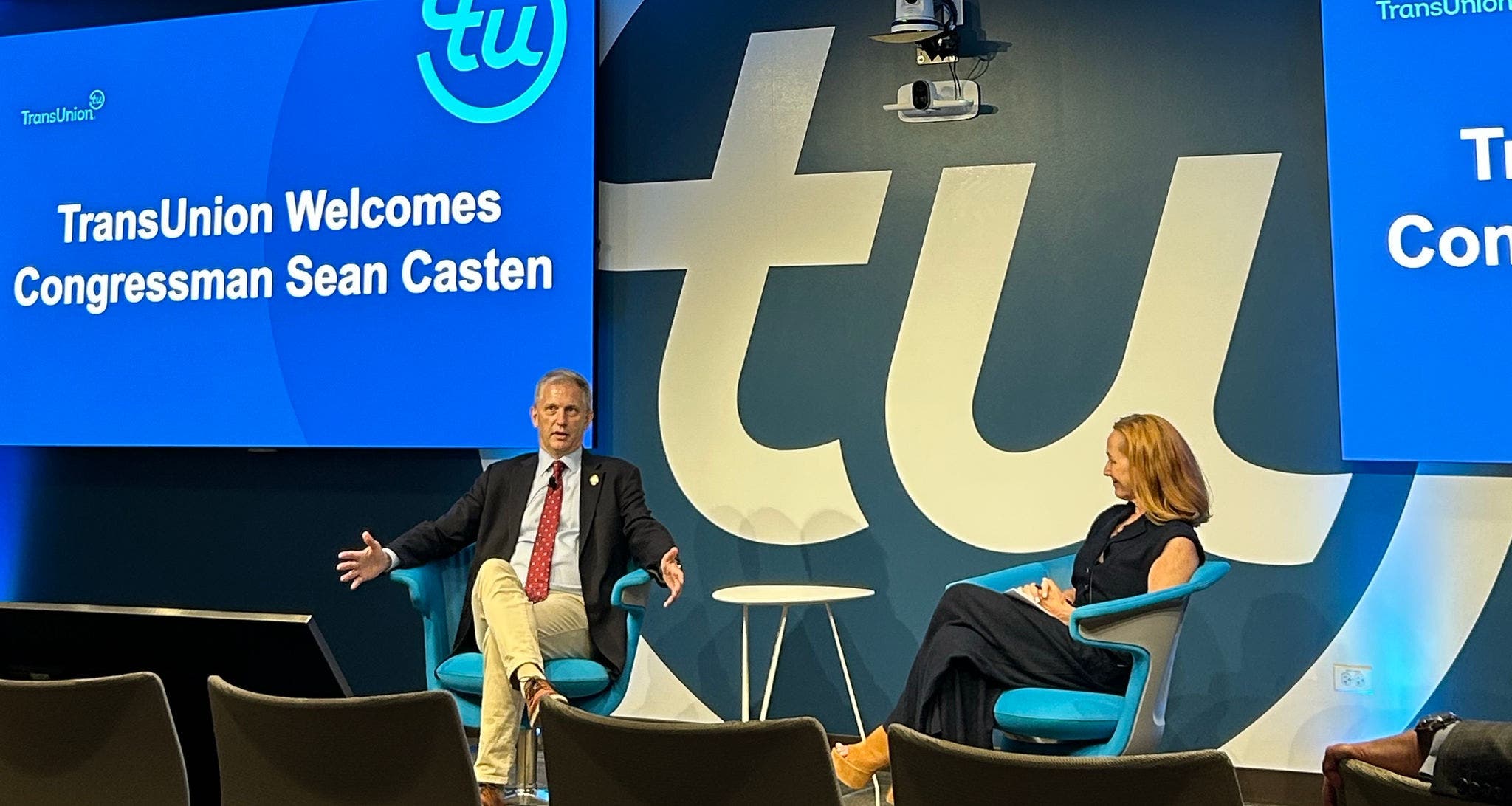 Congressman Sean Casten and Heather Russell Speaking On Stage