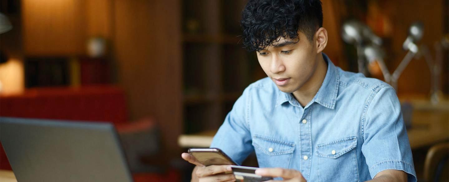 Young man looking at his phone. 