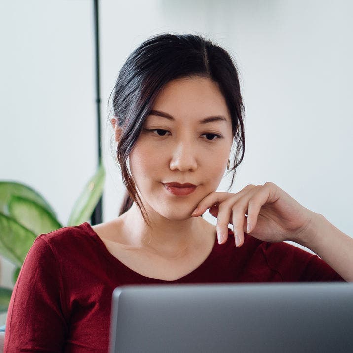 woman looking at laptop