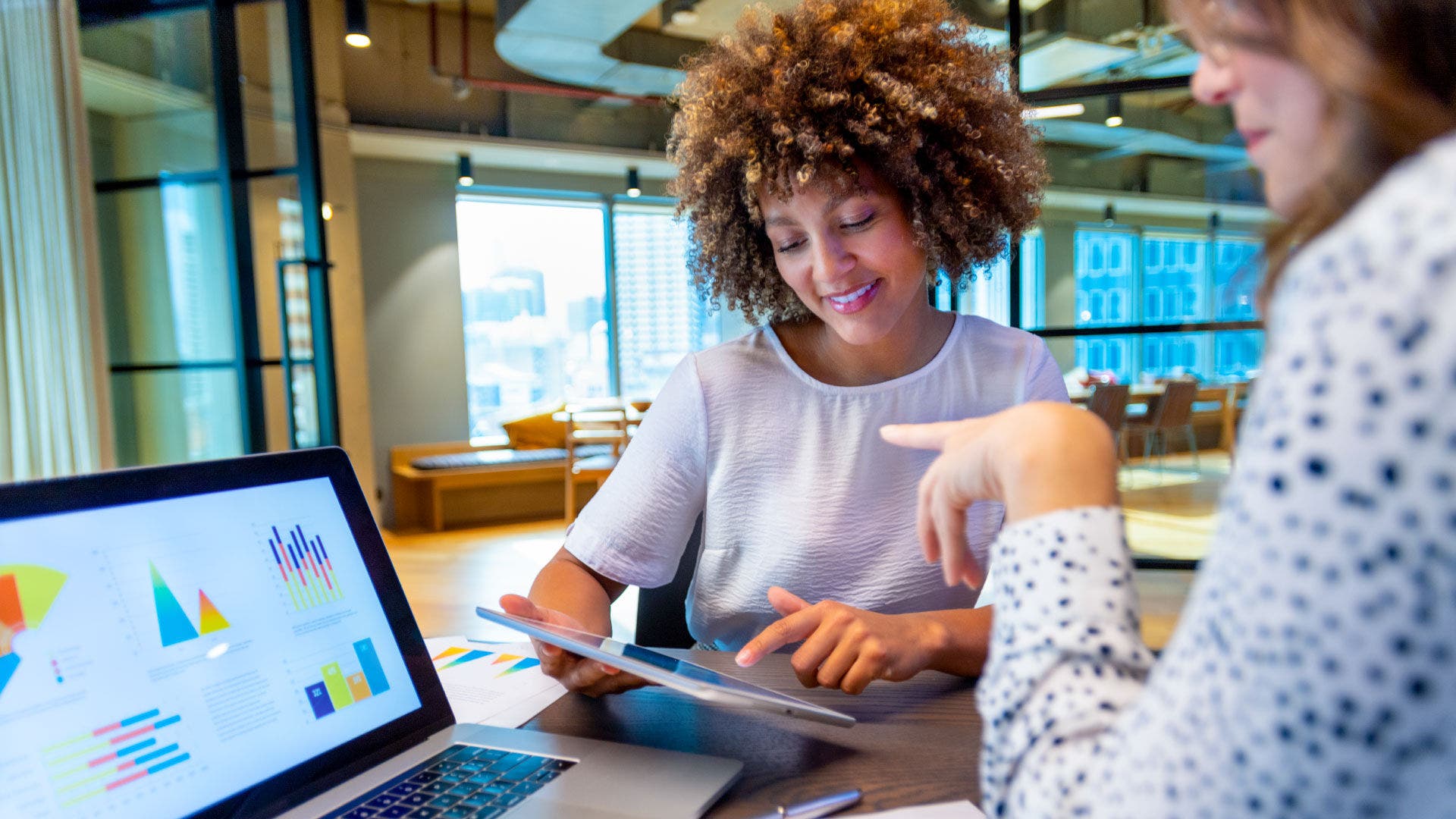 two women discussing data