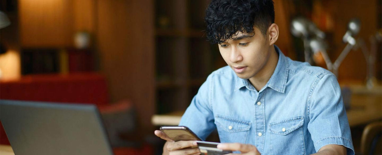 Young man looking at his phone. 