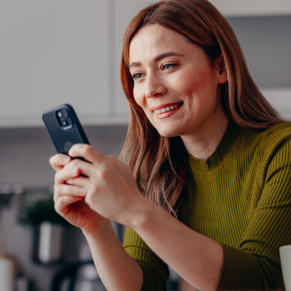 Woman reading mobile phone.