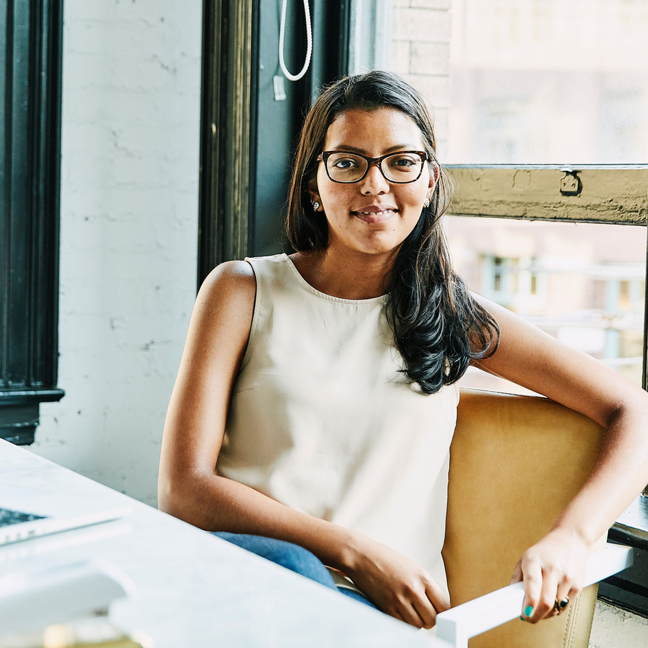 woman sitting at desk in apartment