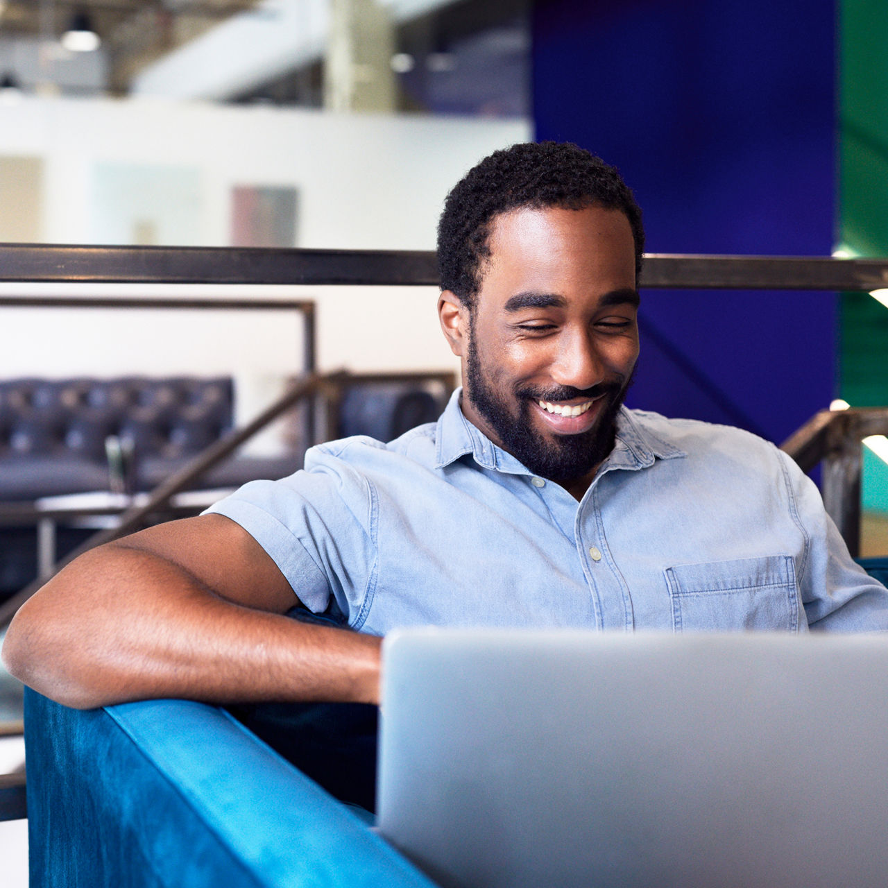 man using laptop in office