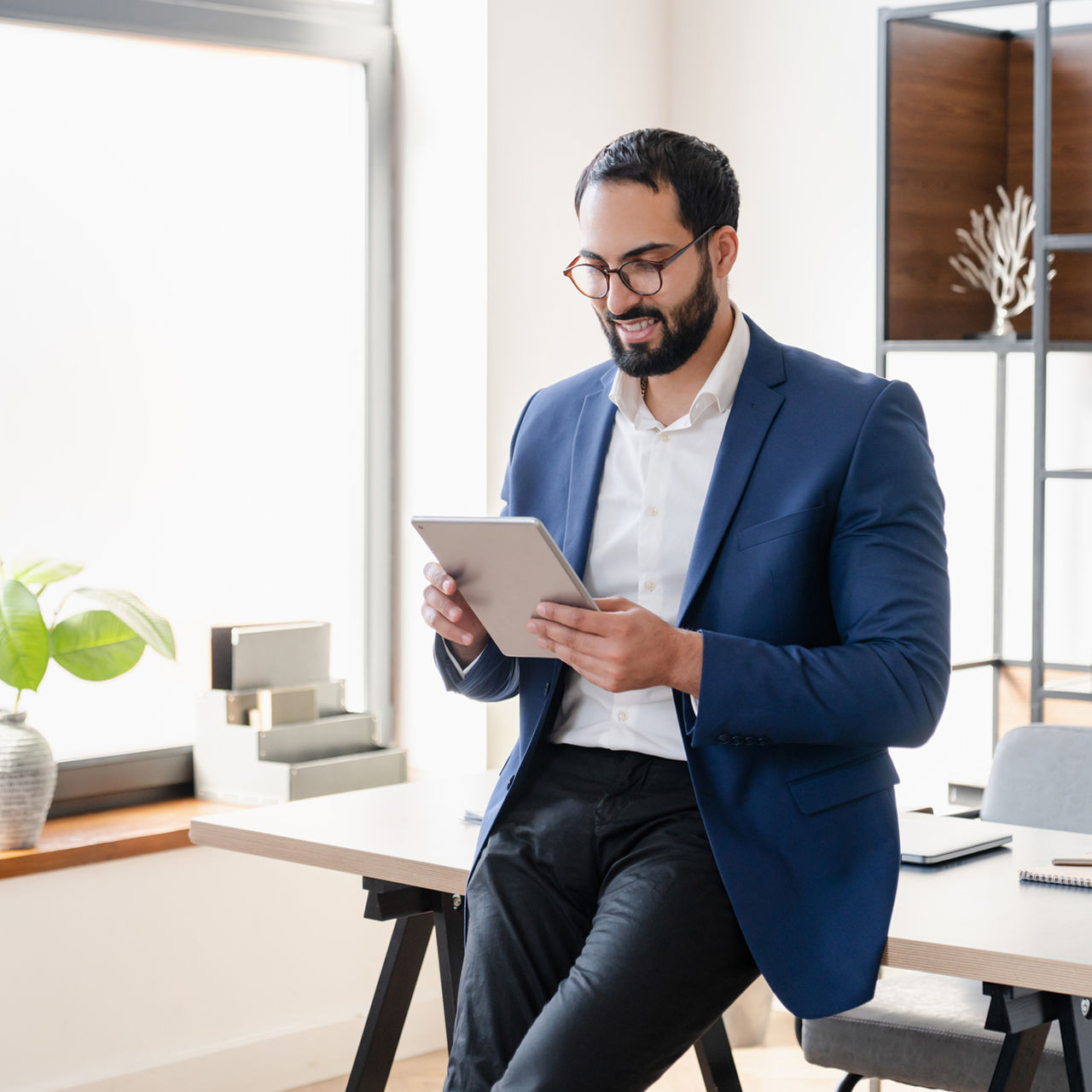 business man using tablet in office