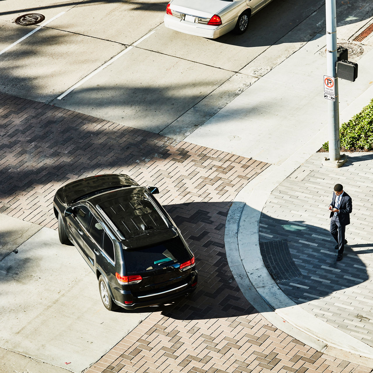 aerial view of a car turning a corner