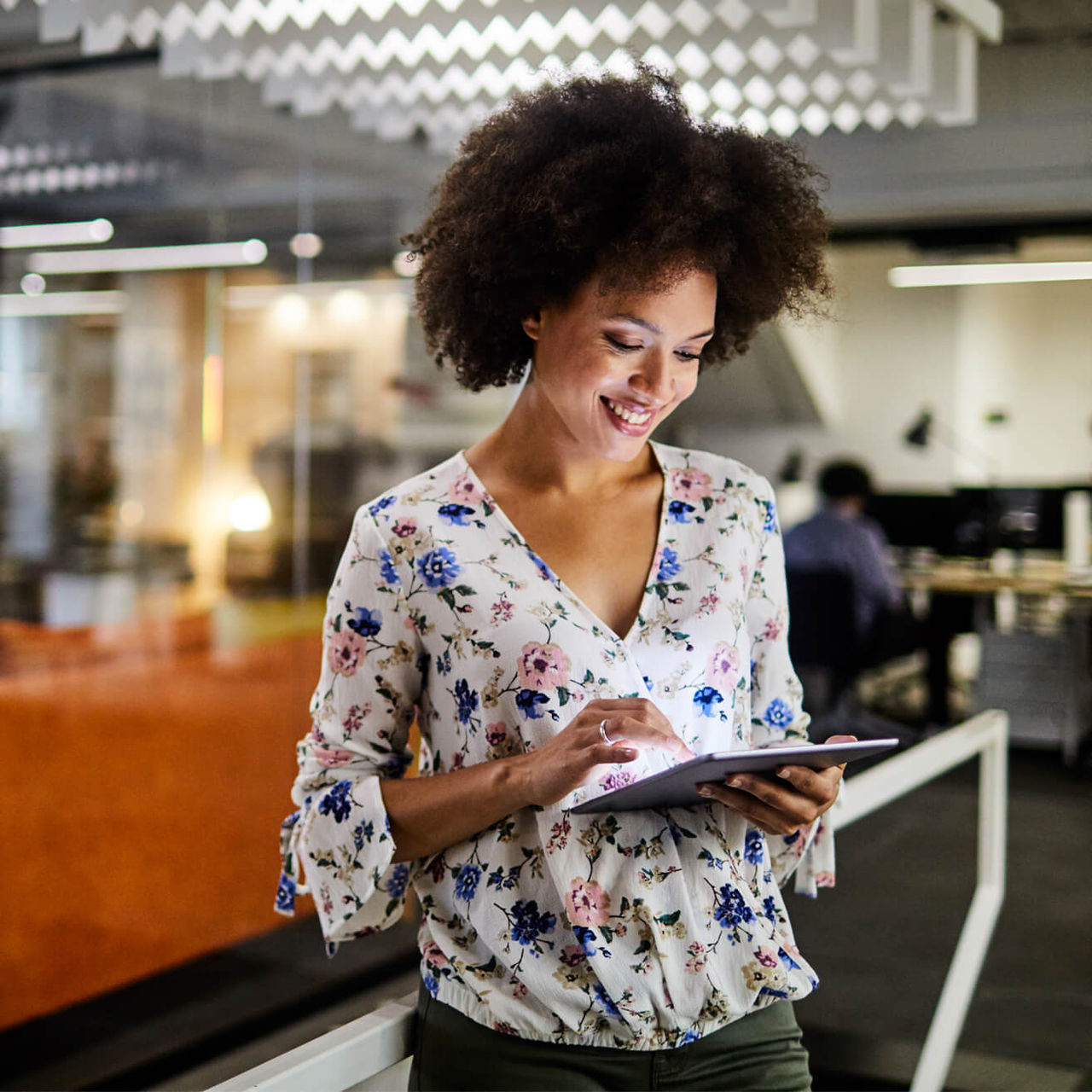 woman using tablet in office