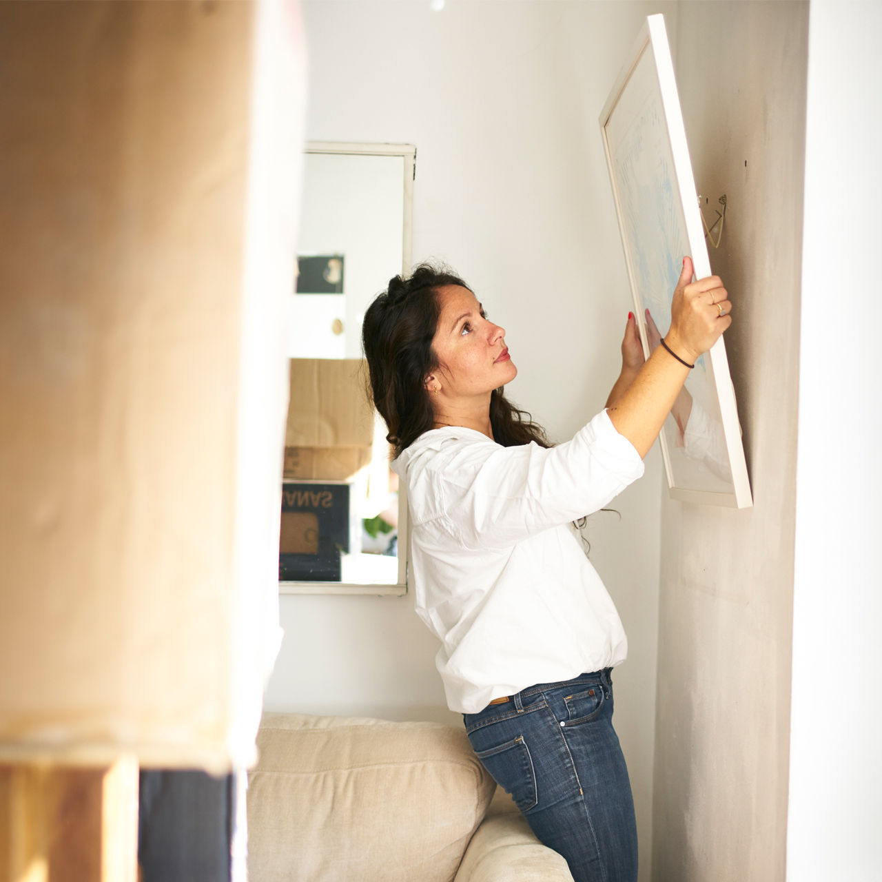woman hanging wall art